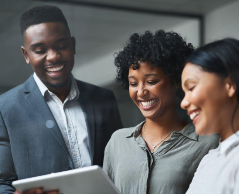 3 people using a tablet